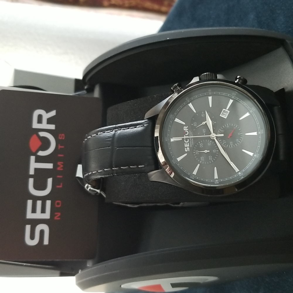 Sector men watch.  New in its original box.  Black leather band.